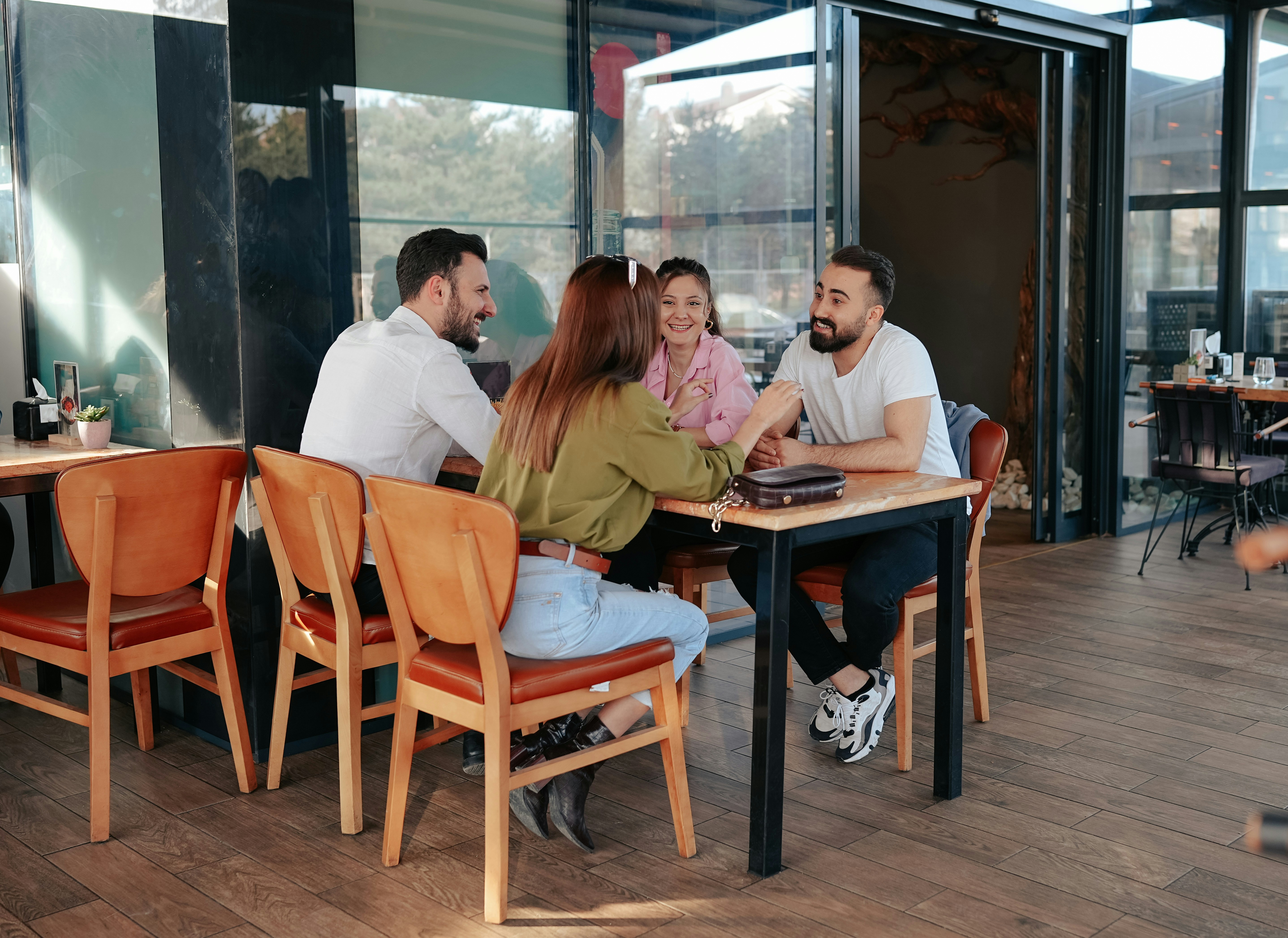 Friends sharing stories at a cafe